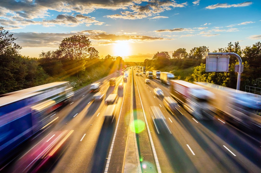 blurred photo of vehicles on multi lane highway